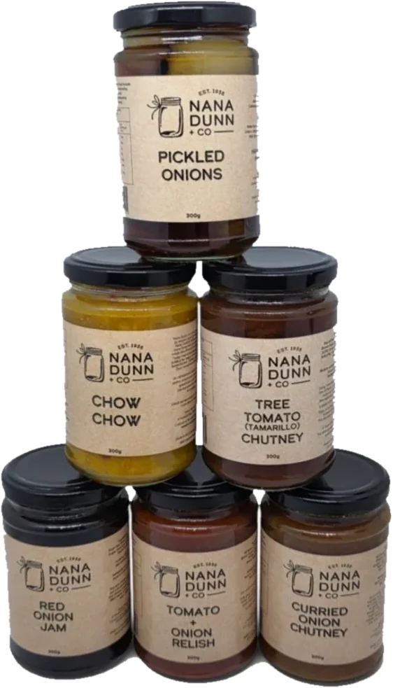 Six Nana Dunn + Co jars stacked in a pyramid: Pickled Onions, Chow Chow, Tree Tomato (Tamarillo) Chutney, Red Onion Jam, Tomato + Onion Relish and Curried Onion Chutney