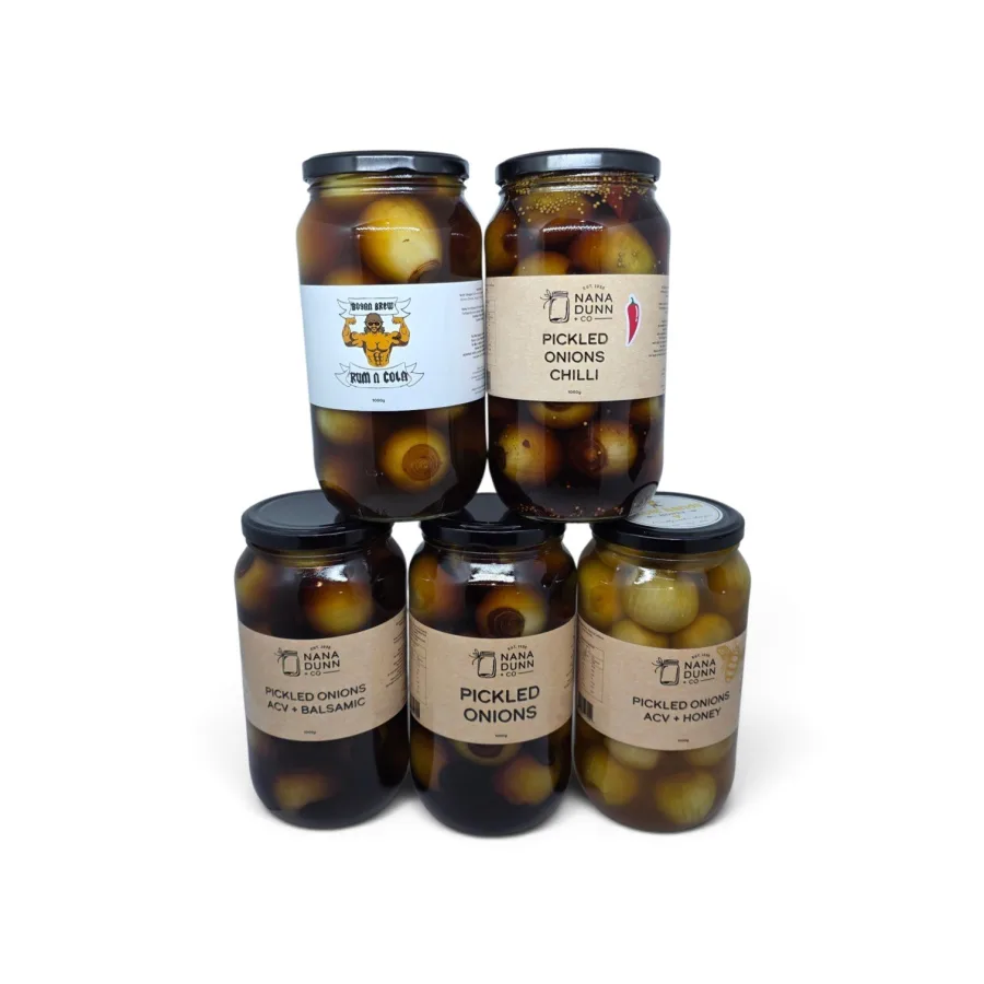 Five large jars of Nana Dunn + Co pickled onions stacked together